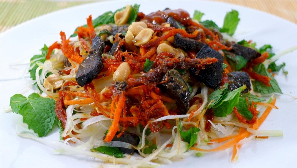 Zesty nom bo kho, combining vibrant vegetables with chewy, seasoned beef 